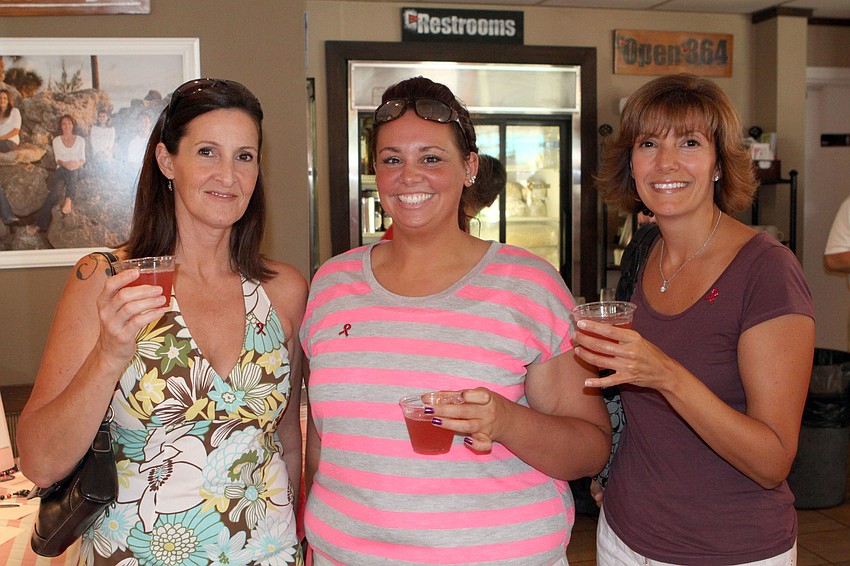 Lisa Amato, Andria Amato and Rita Giannopulos enjoy their pink drinks, Saturday, July 14, at the Village CafÃ©.