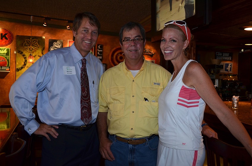 Mike Bear with Dex Imaging, Clayton Thompson with Claytonâ€™s Siesta Grill and Dawn Clayton with Tropical Shores Beach Resorts