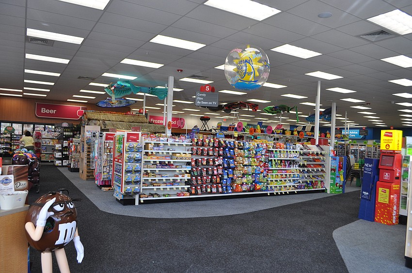 The new 13,000-square-foot store features an enhanced selection of grocery items.