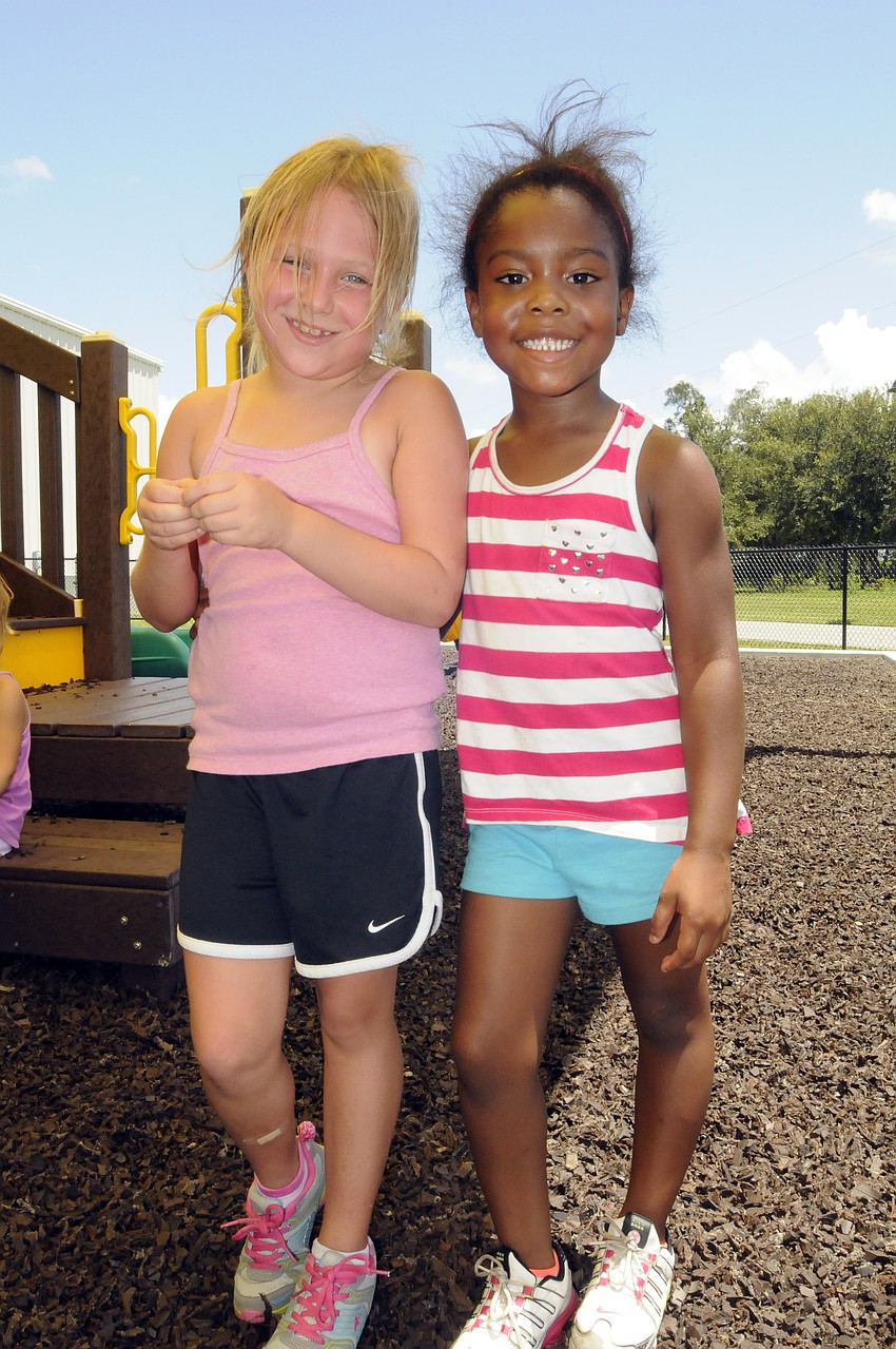 Seven-year-old Savannah Seleska and five-year-old Rosie Hadley enjoyed playing on the playground.