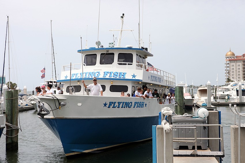 The Kids Klub kids come back from their fishing trip on the Flying Fish, Wednesday, Aug. 8.