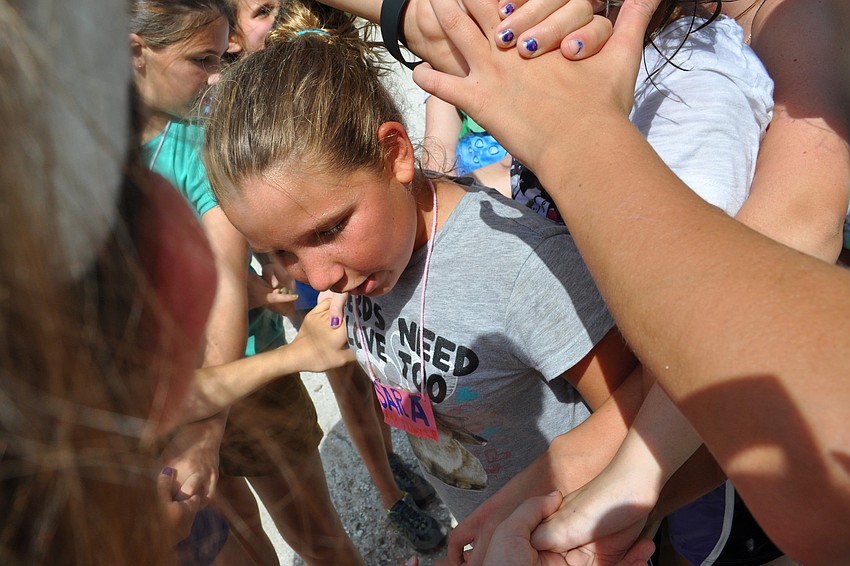 Sara Perkins, 12, helped untie a human knot.