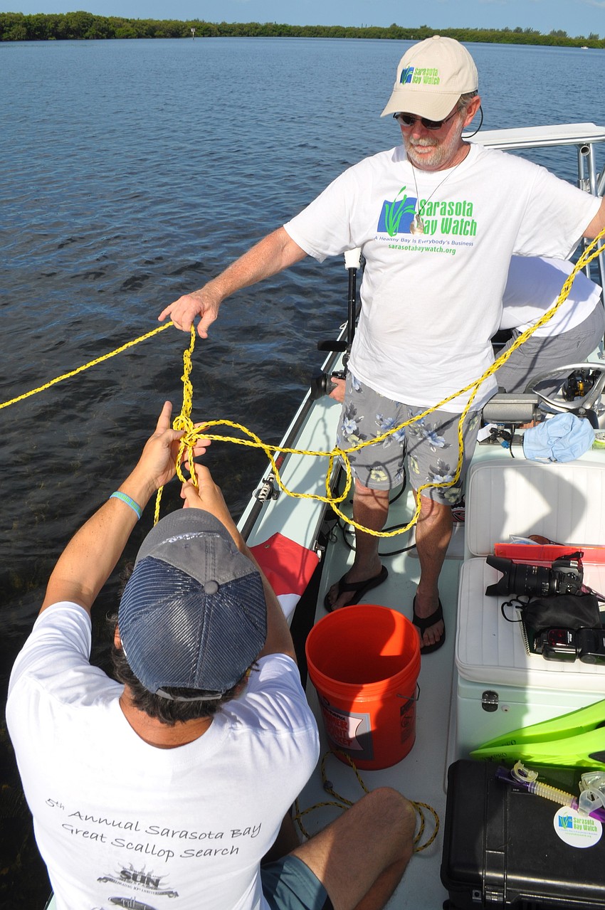 Justin Bloom and Chairman of the Board of Sarasota Bay Watch Rusty Chinnis prepare to search for scallops