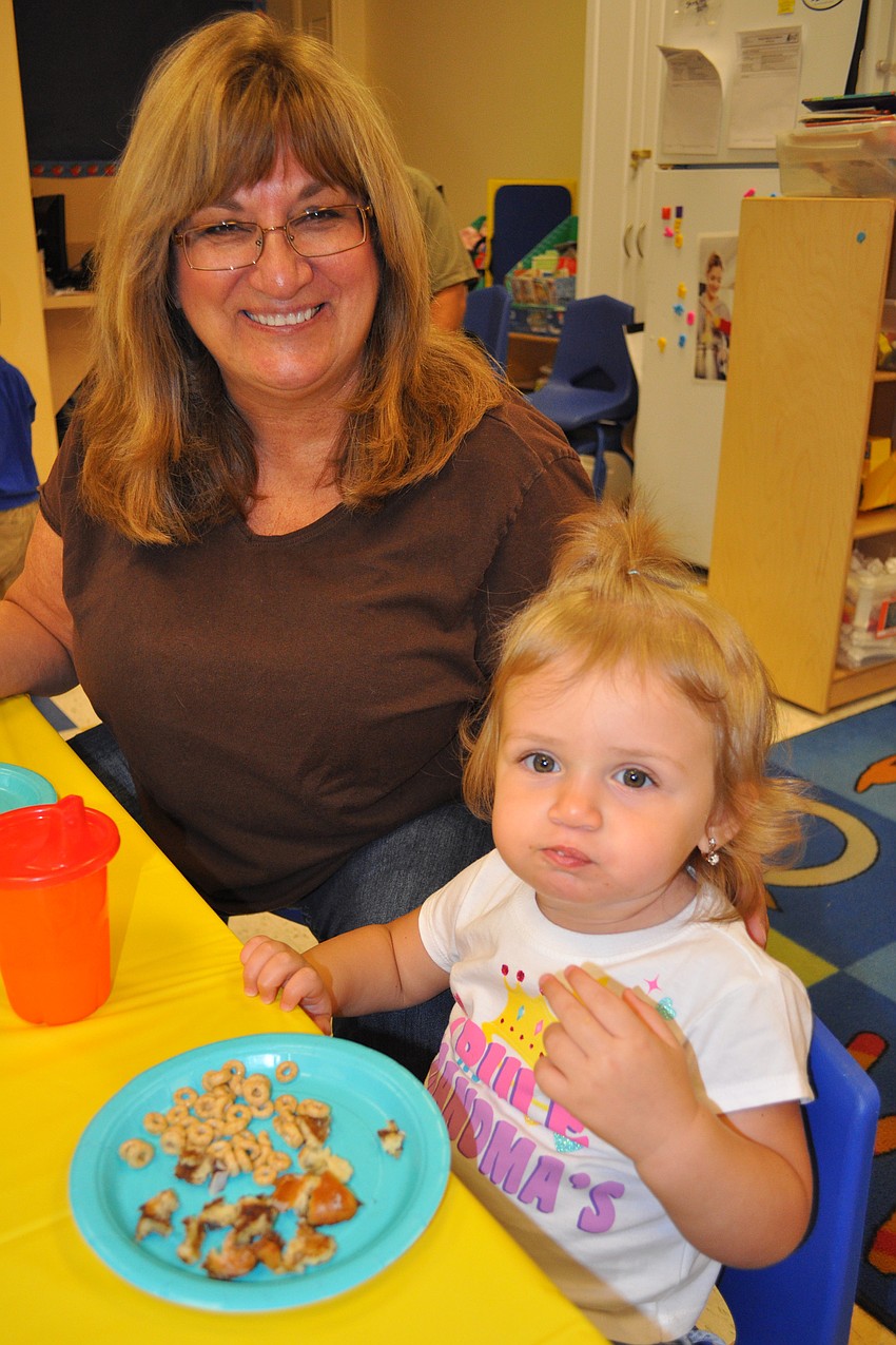 Gabriella Borko, 15 months, enjoyed cheerios with her grandma, Linda Ancil.