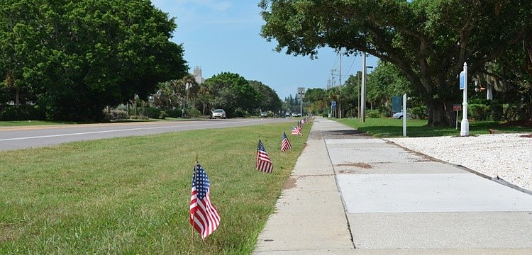 Longboat Key Public Works staff continued its annual tradition on the anniversary of the Sept. 11 terrorist attacks by lining Gulf of Mexico with flags Monday afternoon.