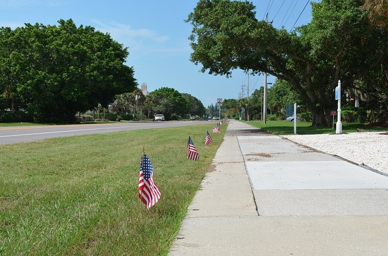 Longboat Key Public Works staff continued its annual tradition on the anniversary of the Sept. 11 terrorist attacks by lining Gulf of Mexico with flags Monday afternoon.