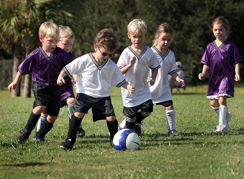 Brennan Abott, 4, gets control of the ball Saturday, Sept. 8.