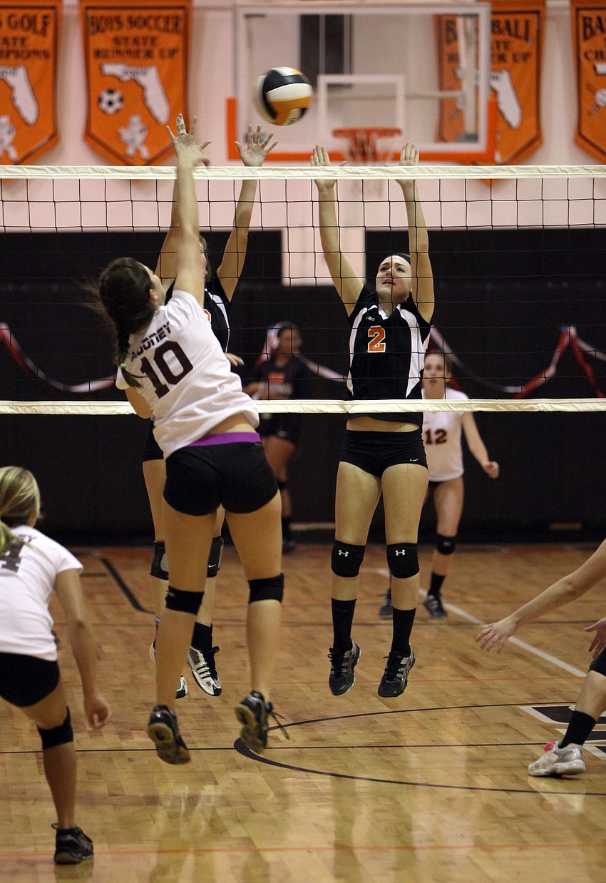 Brooke Schusler, No. 10, spikes the ball back over the net to Sarasota during the Cardinal Mooney versus Sarasota High School JV volley ball game Tuesday, Sept. 11 at Sarasota High School.