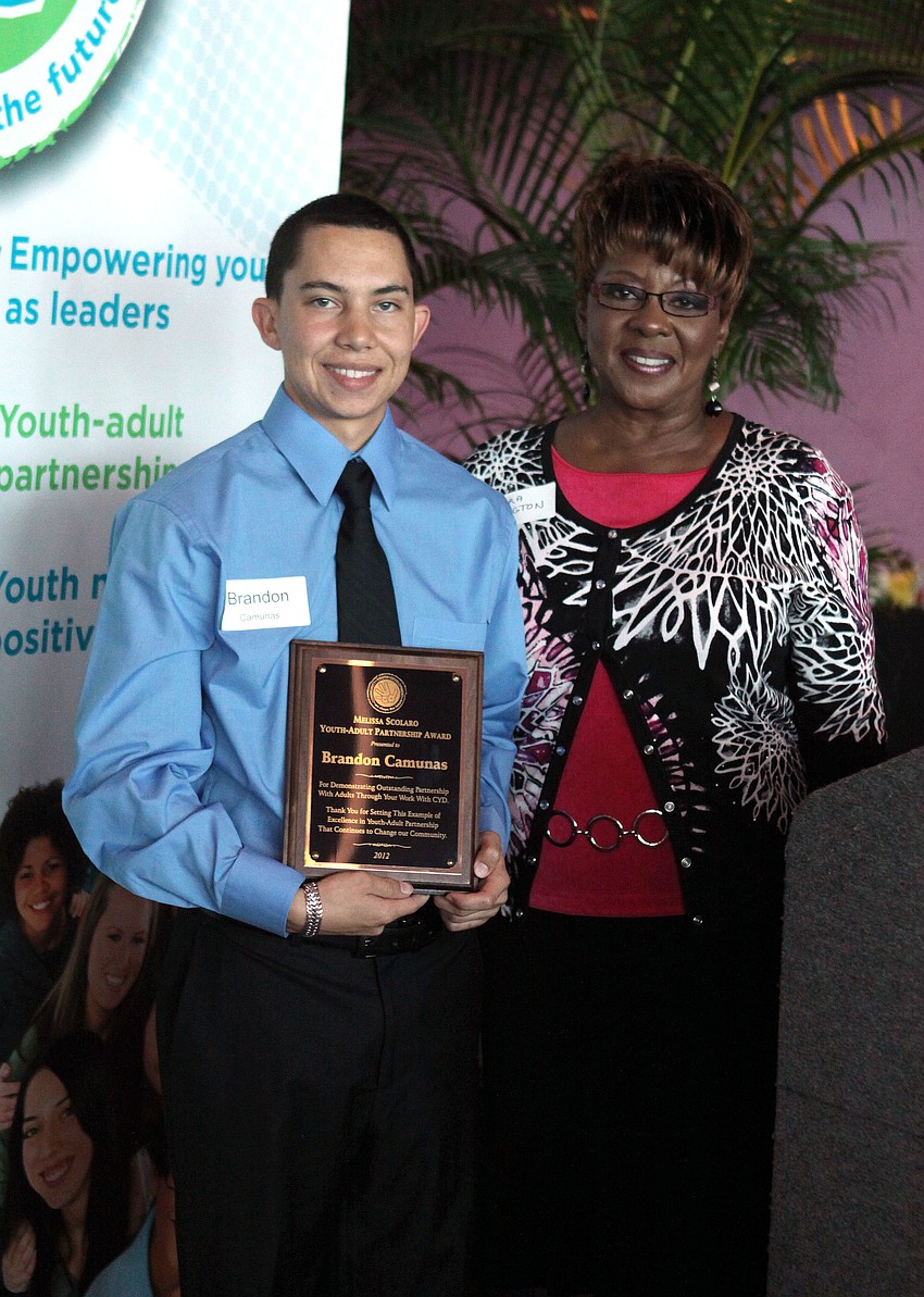 Sandra Washington presented Brandon Camunas with the Melissa Scolaro Youth-Adult Partnership Award, Thursday, May 3, at the Van Wezel.