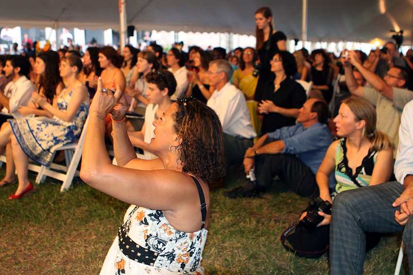 Parents made their way towards the front of the stage to get photos of their sons and daughters graduating, Friday, May 25, at New College.