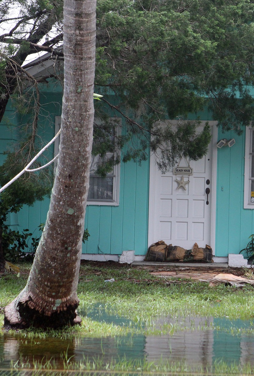 A home had sandbags outside the front door in an attempt to keep the water out.