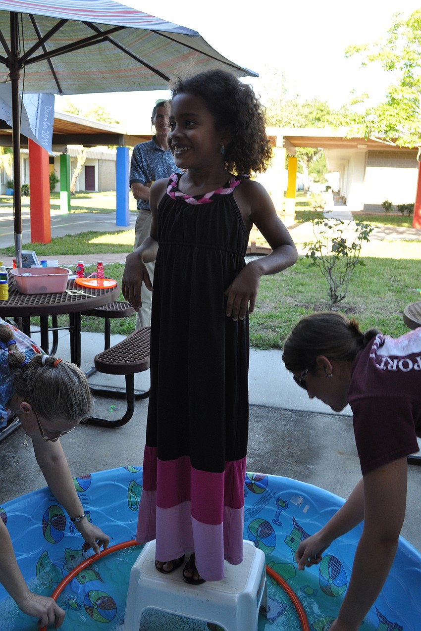 Taya Gaines, 6, was eager to see a giant bubble formed around her.