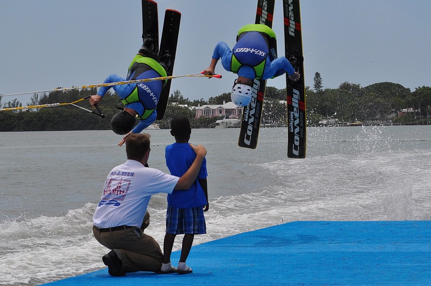 Garrett and Travis Bouley jump over an audience memberâ€™s head