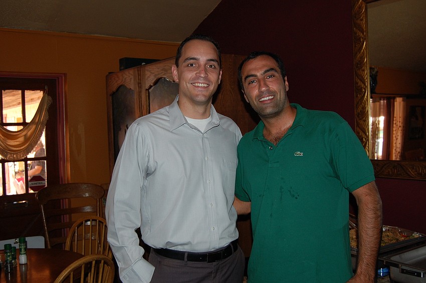 Kevin Cooper, president of Siesta Key Chamber of Commerce; Rami Nehme, managing partner of BlasÃ© Cafe