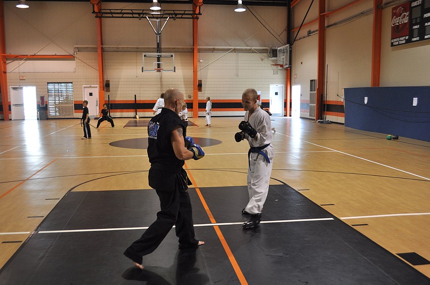 Michael Droeske and Ryan Oâ€™Hern practice their techniques by sparring.