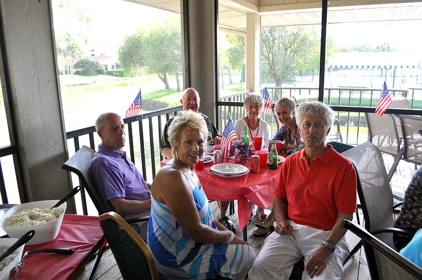 Attendees enjoyed hamburgers and other food on the balcony.