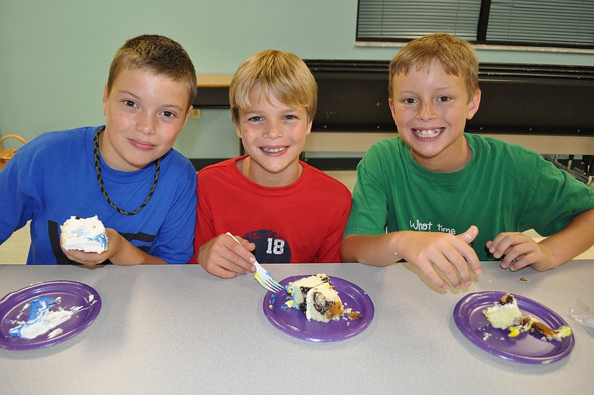 Boston Wompey, Ryan Cody and Clinton Engelberger enjoyed cake before a drumming session.