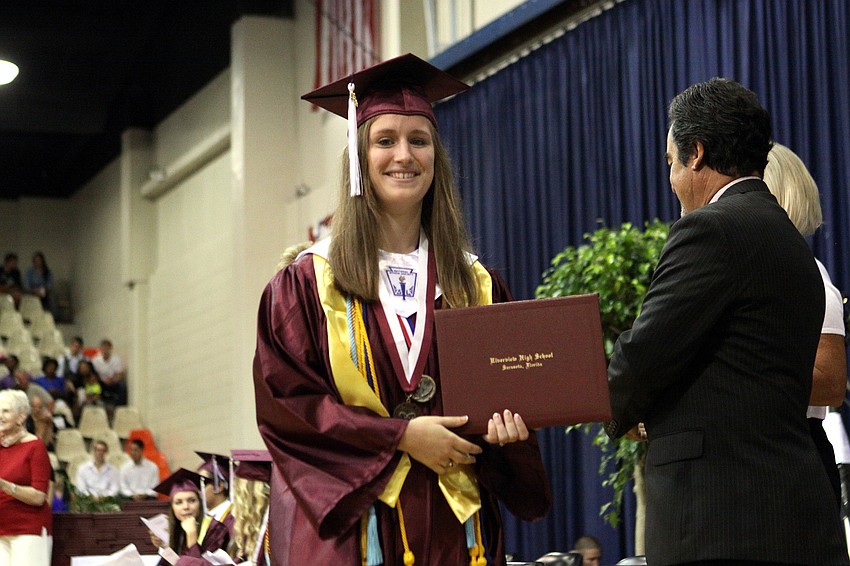 Allison Christie walks off the stage after receiving her diploma, Saturday, June 2.