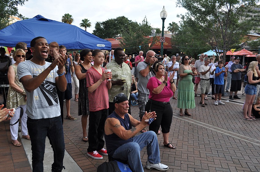 Attendees cheer after a performance of â€œStand by Me.â€