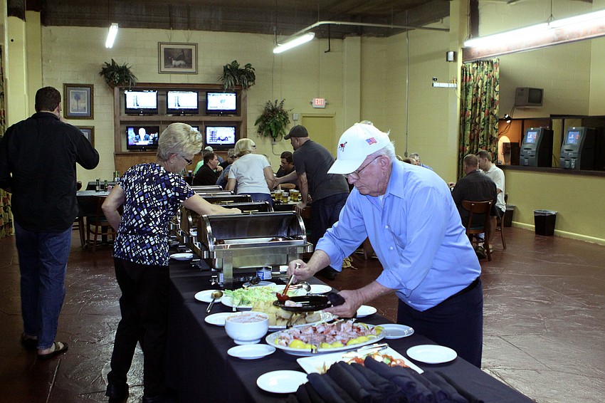 People enjoyed a buffet dinner prior to playing in the poker tournament.