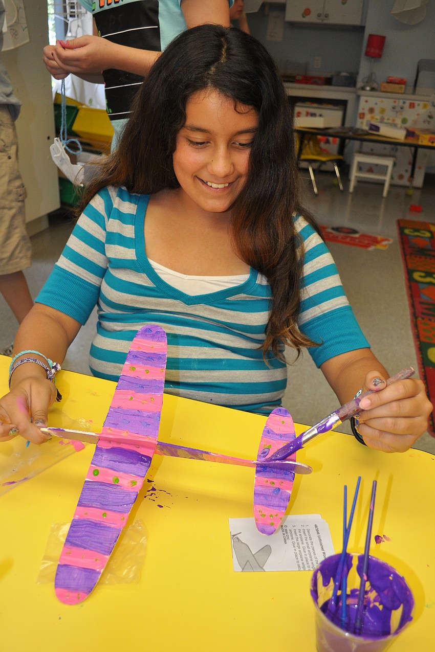 Jazmin Salinas, 11, added the finishing touches to her airplane.