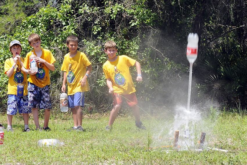 Nine-year-old Jacob Frewin, far right, had a blast launching water bottles.