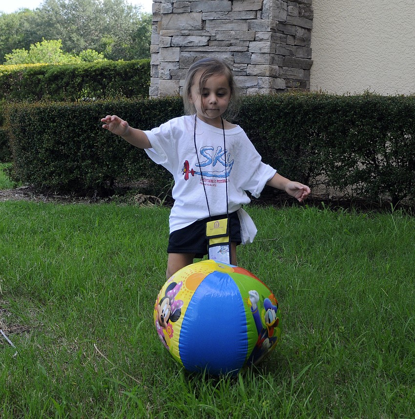 Three-year-old Julia Griffin demonstrated how to fly like a plane.