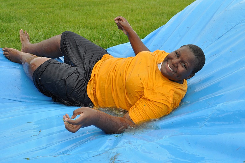 Diamante Ison, 12, enjoyed the inflatable slip 'n slide.