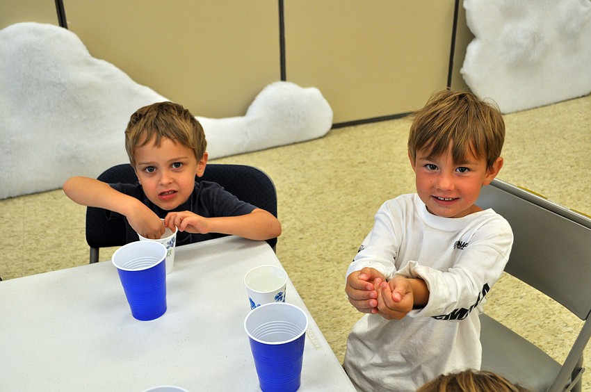 Students Brett and Heath dig into their popcorn.