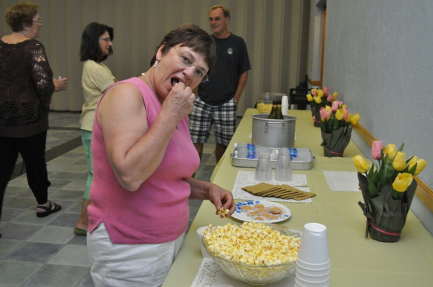 Linda Kelly snacks on popcorn.