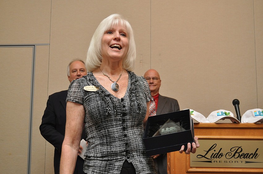 Debra Fortosis of Elite Family Care accepts her award for Rookie of the year