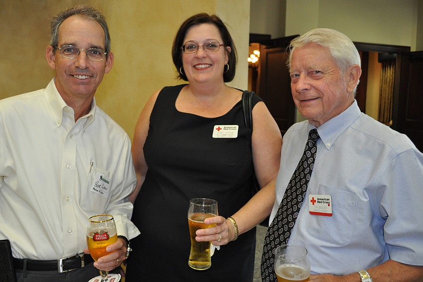 Bob Low, of Perron & Low, with Bobbi Larson and Tom Badger, both of the American Red Cross