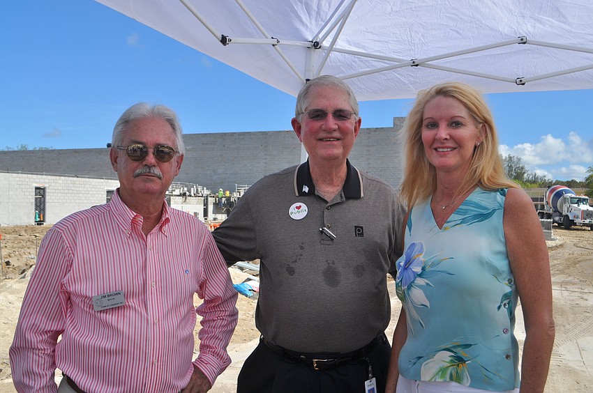 Mayor Jim Brown, Publix Vice Chairman Barney Barnett and Susan Phillips, assistant to the town manager