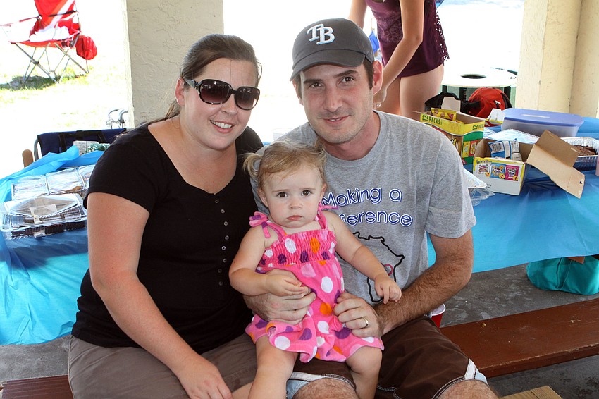 Erin and Clark Means with their daughter, Charlotte, 1.