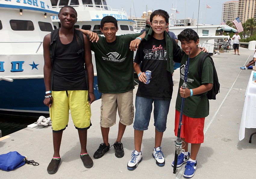 Javonte Carter, 14, Devin Byrd, 13, Esteban Valderrama, 13, and Miguel Basurto, 13, had fun Wednesday, Aug. 8, participating in the Kids Klub Fishing Tournament put on in conjunction with the Sarasota Slam.