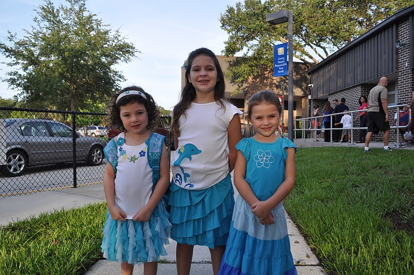 Katerina Herman, kindergarten, Kira Herman, third grade, and Elena Herman, kindergarten