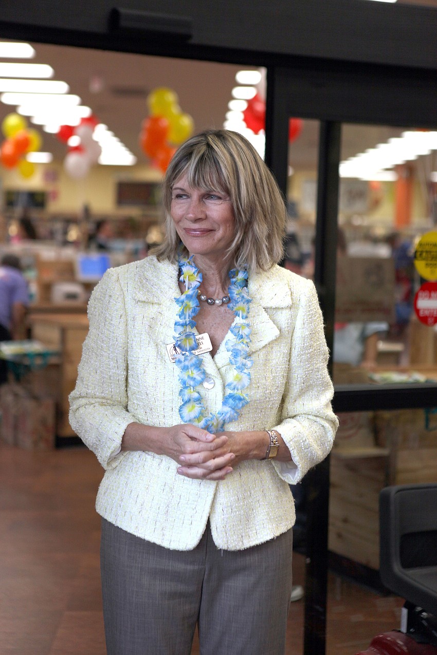 Mayor Suzanne Atwell smiles as customers make their way into the new Trader Joeâ€™s Friday, Sept. 7.