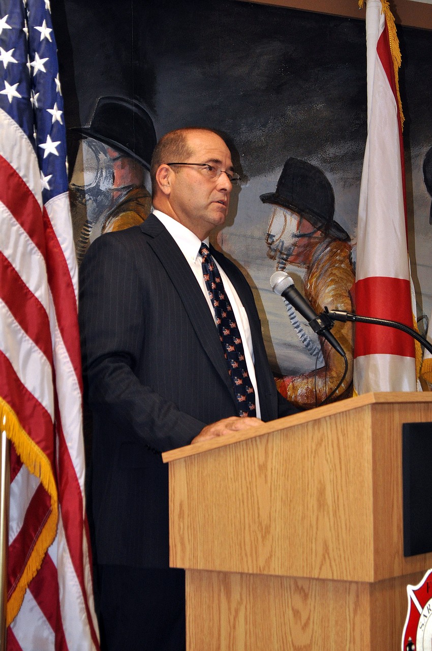 Tom Harmer, the assistant county administrator, spoke to the crowd that attended the remembrance ceremony at Station #2.