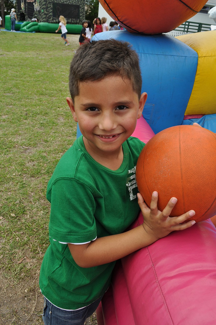 Alan Aguilar, 6, was eager to play basketball.