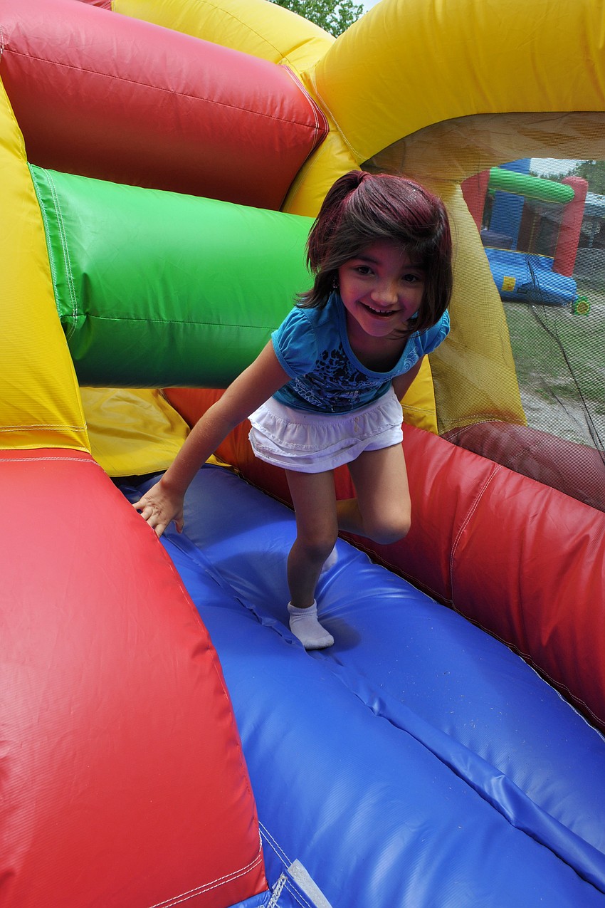 First-grader Gabby Ramirez made her way through the inflatable obstacle course.
