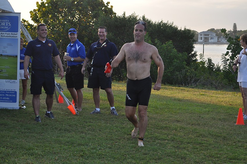 Longboat Key Fire Chief Paul Dezzi gets cheered on by his coworkers