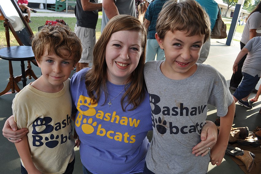 Holly McAndrew, center, enjoys the day with her sons, Owen, left, and Thomas, right.