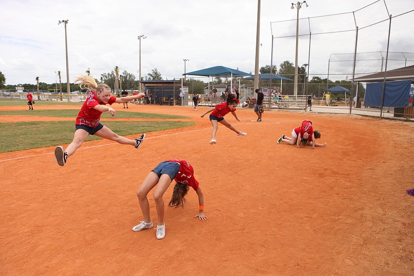 The cheerleaders for the Braves perform on the field between innings, Friday, May 4, during Ashton Elementaryâ€™s World Series Day at Twin Lakes.