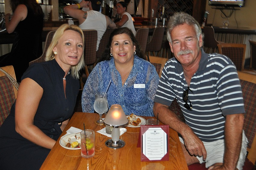 Dawn Mims with Longboat Key, Lido Key, St. Armands Key Chamber of Commerce, Yvonne Schloss with Sunglass Express Optical and Steve Sweeney with Consider it Done