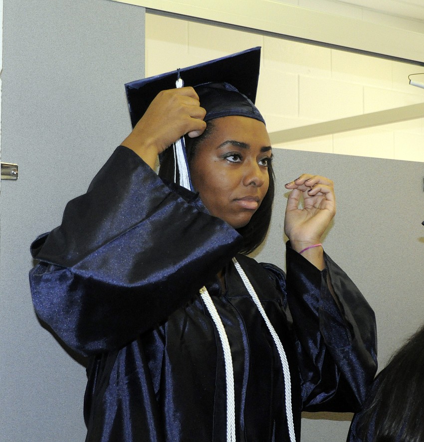 Morgan Williams adjusts her tassel before the ceremony.