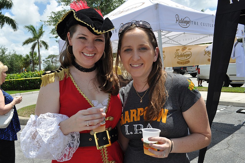 Kristina Paape, pictured with her friend Danielle Kluenie, right, donned her old pirate Halloween costume for the occasion.