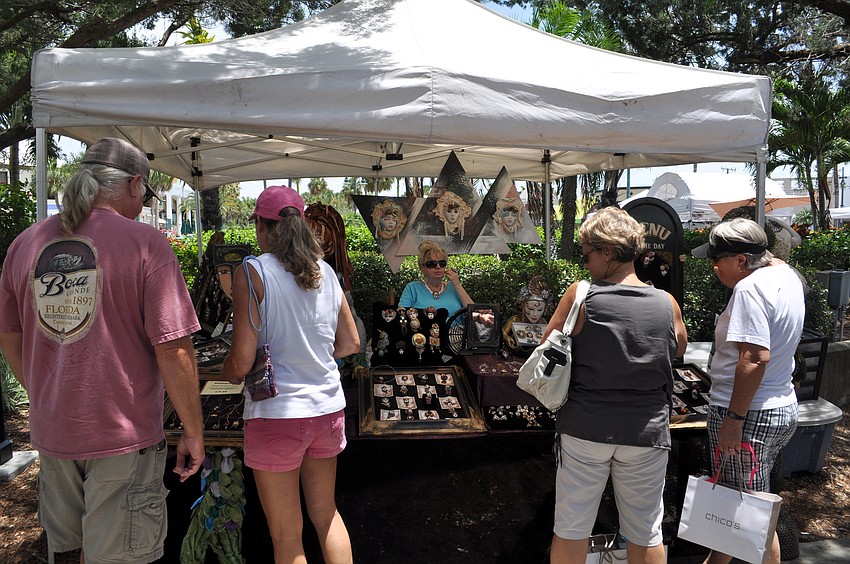 Customers browse one of the festivalâ€™s many tents.