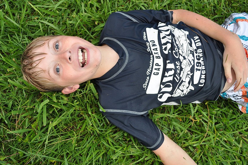 Josiah Clauson, 10, rolled off the water slide for kicks.