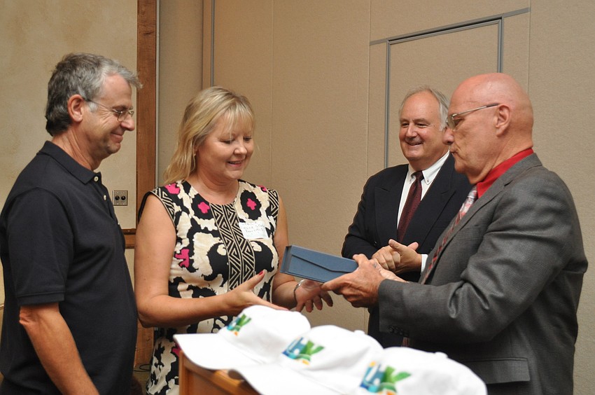 Mike and Sheila Lewis accept the certificate for Runner up in the 10 and fewer category from President Tom Aposporos and Chairman of the Small Business Council Larry Bierman