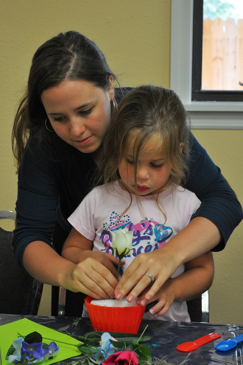 Volunteer Shulie Shur assisted Zoe Korman, who turned 5 on June 26.